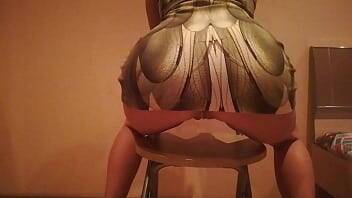 Erotic dance on a chair in a dress made of snake skin on vidgratis.com