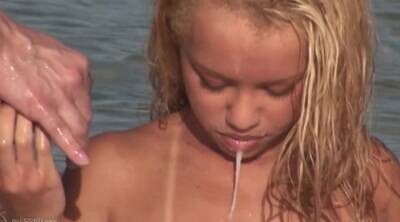 Blonde Beauty Gets Cum In Her Mouth In This Hot Threesome On The Beach on vidgratis.com