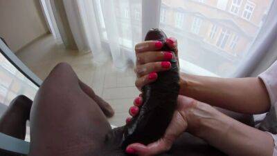 A petite blonde plays with the foreskin of a huge black cock. on vidgratis.com