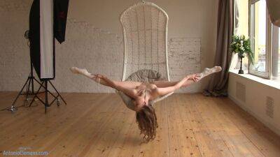 Flexible Beauty Ballerina Playfully Poses For Me In A Hanging Chair, Moving Her Long Legs Wide. 4 Of 6 on vidgratis.com