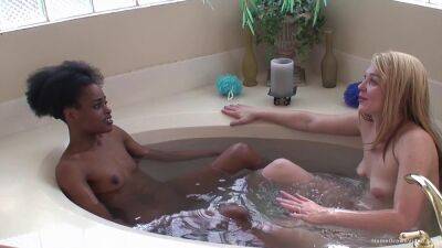 Ebony lesbian and her blonde girlfriend fuck in the tub on vidgratis.com