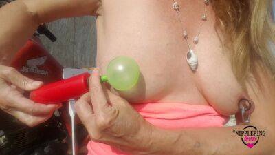 Nippleringlover Horny Milf Sticking Balloons Through Extreme Stretched Pierced Nipples Outdoors on vidgratis.com