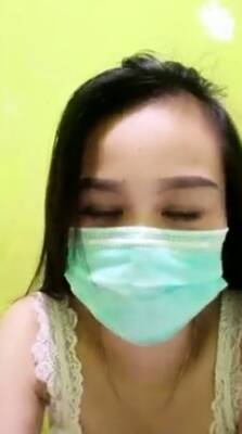 Playful Indonesian hottie wears a facemask while rubbing - Indonesia on vidgratis.com