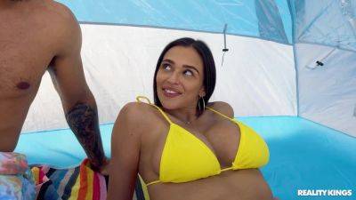 Dark-haired beauty in a yellow bikini takes good care of BBC on vidgratis.com