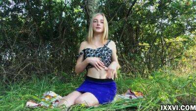 Beautiful young girl outdoor masturbating her pussy in the woods in a clearing on vidgratis.com