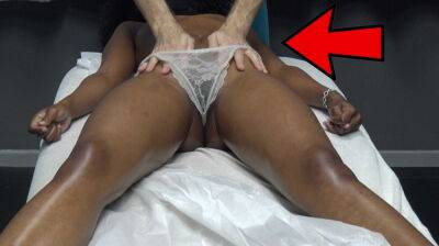 Masseur makes horny black milf massage the customer by pulling the lace underwear on her oiled pussy lips on vidgratis.com