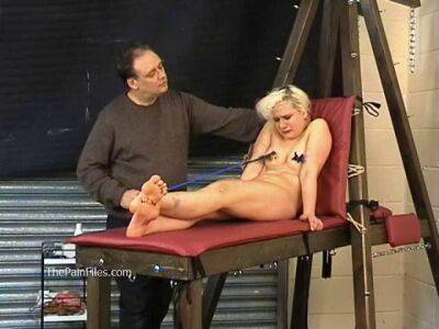 Busty blonde is punished with hot wax and hard spanking on vidgratis.com
