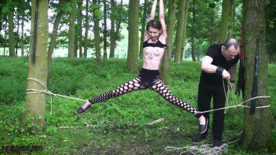 Submissive teen tied up in the woods on vidgratis.com