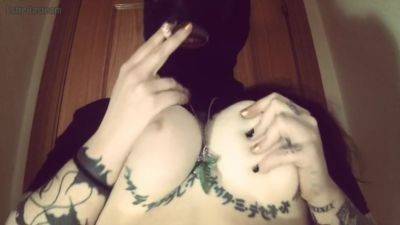 Girl With A Mask Plays With Her Tits And Smokes A Cigarette on vidgratis.com