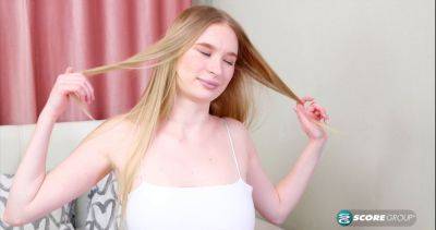 Asya, the blonde teen, spreads her legs wide open and toys her shaved cunt with a massive dildo on vidgratis.com